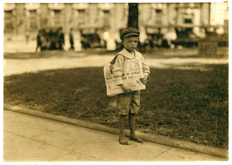 "7-year-old newsie." By Lewis Hine [Public domain], via Wikimedia Commons.