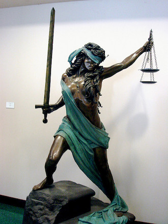 Statue of Justice at Saint Louis University School of Law. Photo credit: Ann Althouse. Flickr (CC BY-NC 2.0)