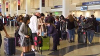 U.S. Holiday Travel Surges as U.S. COVID-19 Cases Soar Past 12 Million