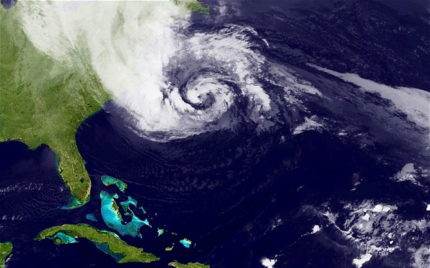 A satellite image of Hurricane Sandy, pictured at 00:15 UTC, churns off the east coast of the US Photo: NASA via Getty Images