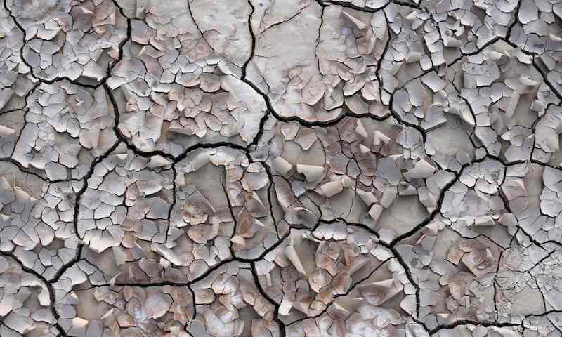   Cracked soil by a village in Iran abandoned by farmers because water reserves ran dry due to overuse. Photograph: Atta Kenare/AFP/Getty Images