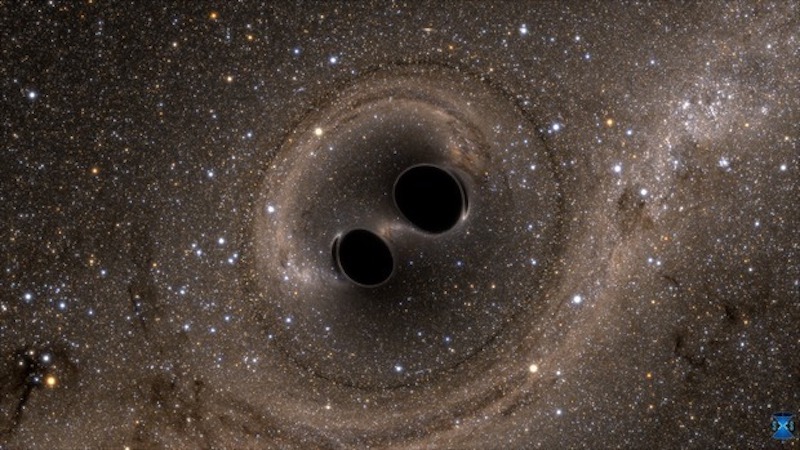 Merging black holes generate gravitational waves. These ripples in space-time might be used to unveil hidden dimensions. Credit: © Simulating eXtreme Spacetimes (SXS)