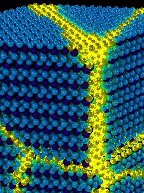 Artist's depiction of the collective excitons of an excitonic solid. These excitations can be thought of as propagating domain walls (yellow) in an otherwise ordered solid exciton background (blue). Credit: Peter Abbamonte, U. of I. Department of Physics and Frederick Seitz Materials Research Laboratory